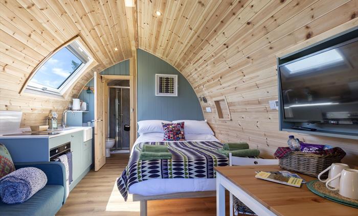 Each Pod includes - Double Bed, Bunk Bed, Kitchenette, Cooker/ Microwave, Hob, Fridge, Kettle, Toaster, TV, Free Wi-fi, En-suite shower room, Outside